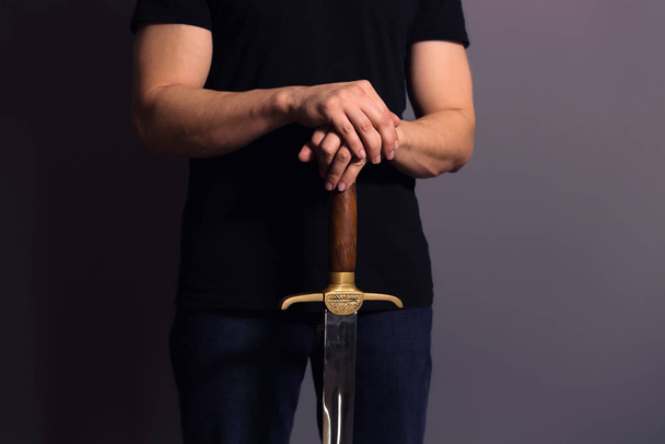Young Athletic Man Holding His Sword - Photo, Image