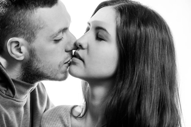 young romantic couple together black and white emotional portrait on white background - Foto, Bild