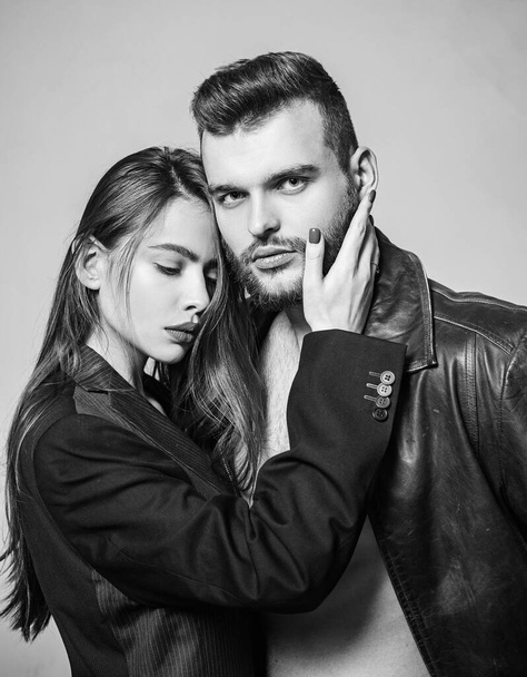 Fashion couple. Sensual lovers. Girlfriend passionate red lips and man leather jacket. Passionate hug. Couple passionate people in love - Foto, afbeelding