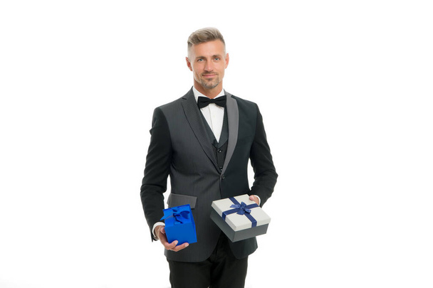 Birthday holiday. Shopping mall. Shop purchase. Gift package. Womens day. Valentines day. Gentleman delivering gift. Handsome man with wrapped gift box. Happy businessman hold present in hand - Фото, изображение