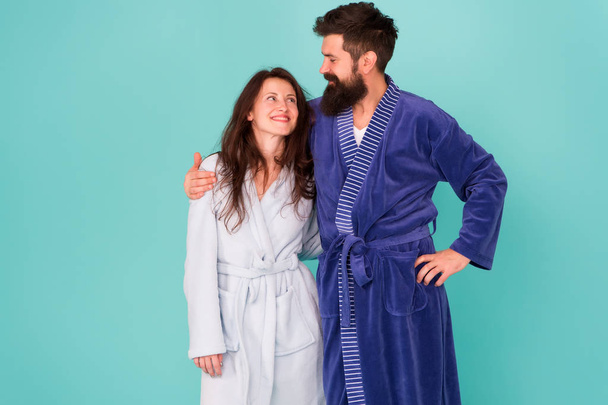 Perfect rest. Feeling good. Couple in love enjoy relax. Happy morning. Vacation starting here. Sleepy man and woman happy together. Family traditions. Couple in cozy bathrobes enjoy lazy weekend - Фото, зображення