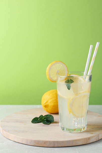 Delicious lemonade in glass on light table - Fotografie, Obrázek