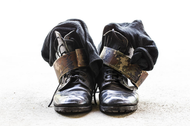 Black Leather Army Boots on the cinders   - Photo, Image