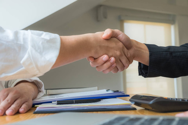 Successful handshake, summing up, correct product balance, trade - Photo, Image