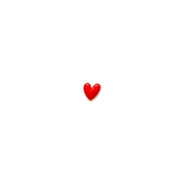 small red heart and white background and copy space. - 写真・画像