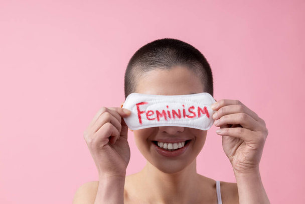 Woman closing eyes with sanitary pad stock photo - Foto, immagini