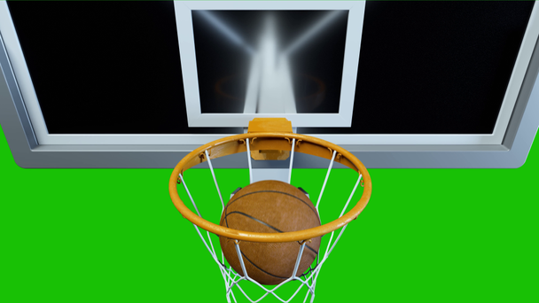 Basketball traf den Korb in Zeitlupe auf grünem Hintergrund - Filmmaterial, Video