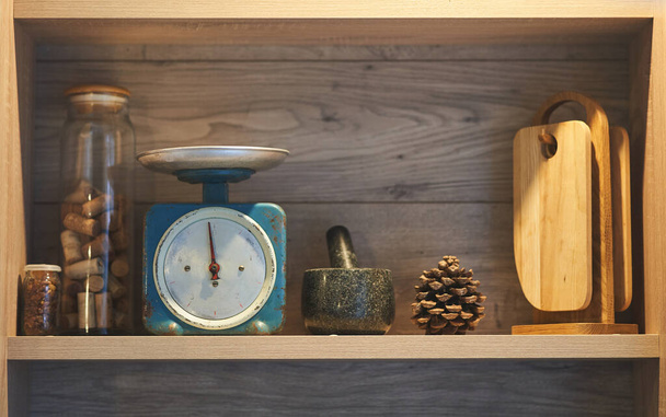Kitchen shelf with scales, chopping boards.  - Photo, Image
