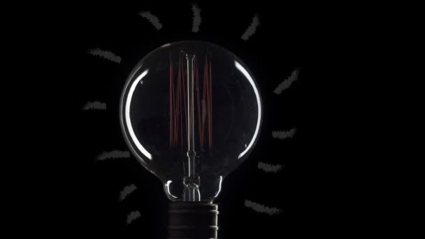 idea bombilla parpadeo lámpara de tungsteno bombilla sobre fondo negro
 - Metraje, vídeo