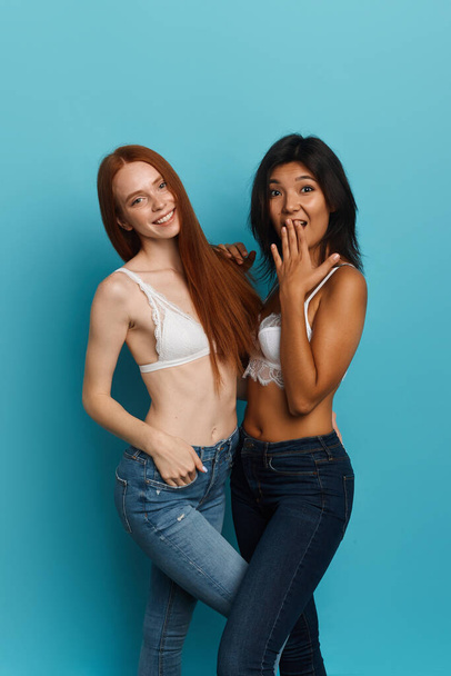 Surprised sexy women in jeans being shocked with sale - Fotó, kép