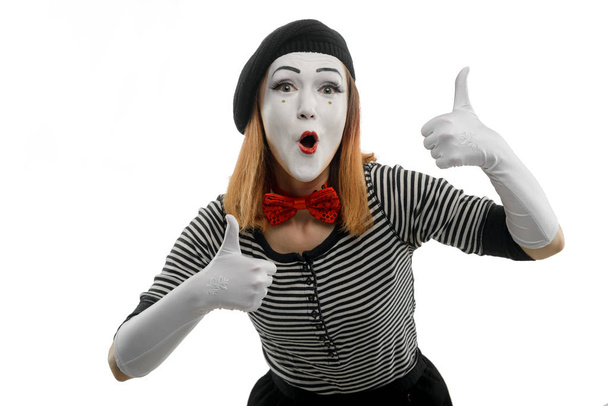 Female mime shows thumbs up of both hands - Foto, Bild