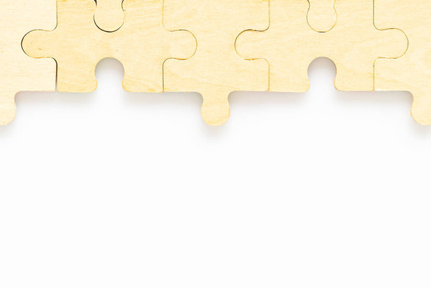 wooden jigsaw puzzle pieces on white background - Photo, Image