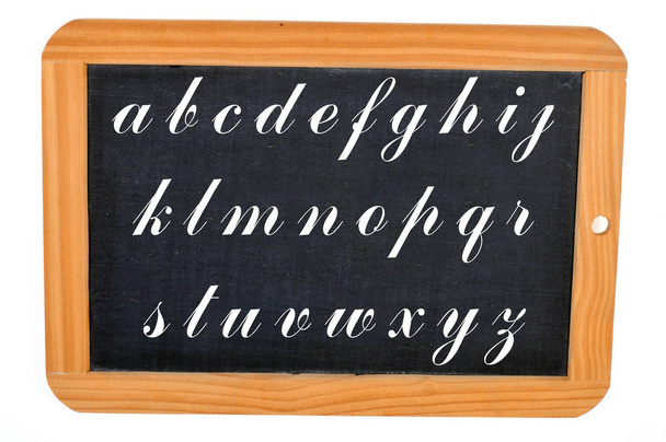 Alphabet written on a school slate close-up  - Photo, Image