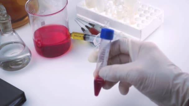 A doctor is doing a blood sample test for coronavirus 2019-nCoV. Concept - a new dangerous virus from China - Imágenes, Vídeo
