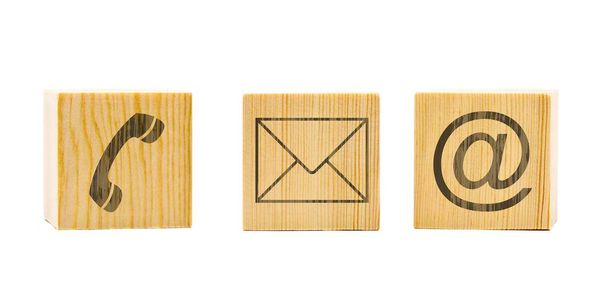 Contact us symbols with phone, e-mail and envelope icons on three brown wooden cubes on white - Φωτογραφία, εικόνα
