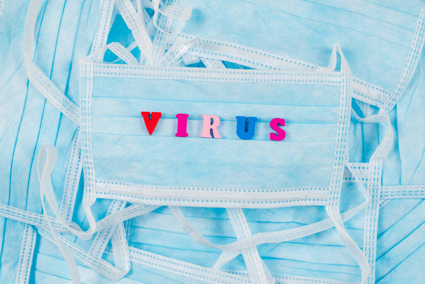 Colorful word virus on protective masks. - Fotografie, Obrázek
