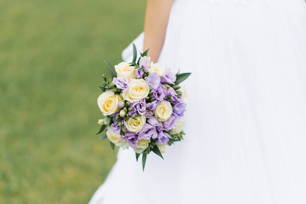 Beautiful delicate wedding bouquet of the bride with lilac eusto - Photo, Image