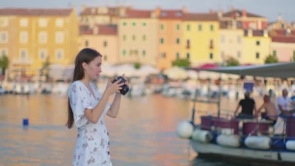 Girl capturing Rovinj quay, Croatia - Footage, Video