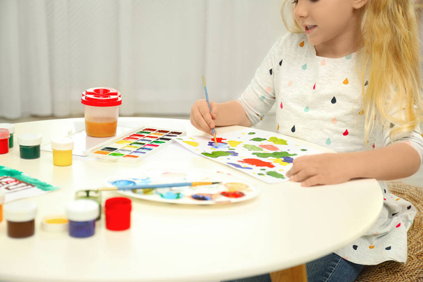Little child painting at light table, closeup - Foto, Imagem
