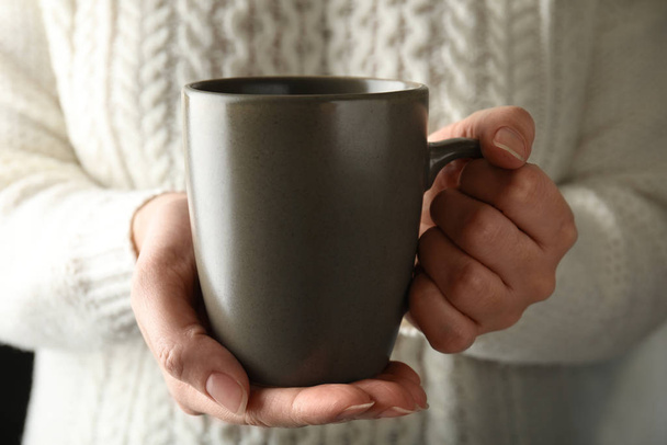 Woman holding cup of hot winter drink, closeup - Фото, изображение