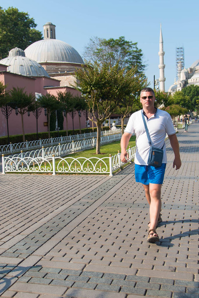 Man tourist with city on background. Istanbul, Turkey. - 写真・画像