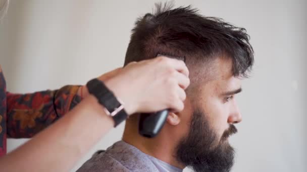 Bearded Man Getting a Haircut in a Barbershop Hairdressing - Felvétel, videó