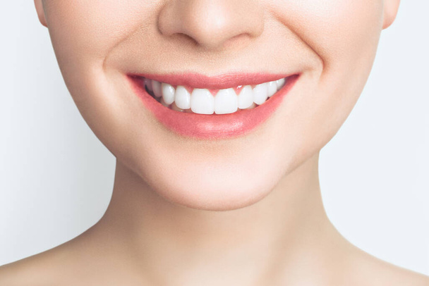 Perfect healthy teeth smile of a young woman. Teeth whitening. Dental clinic patient. Image symbolizes oral care dentistry, stomatology. Dentistry image. - Photo, image