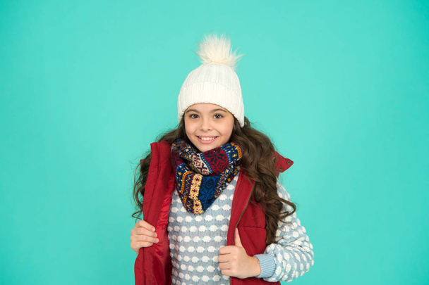 Christmas fun. feeling cold this season. Dress in layers and hat. Stay active. it is cold outside. kid warm knitwear. winter vibes. Portrait of smiling girl hipster. Youth street fashion. Winter fun - Фото, изображение
