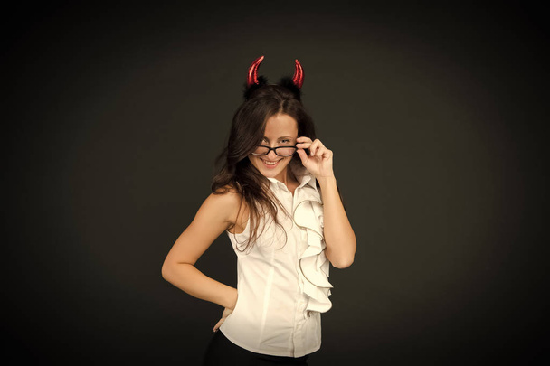 Halloween corporate party. Party girl celebrate Halloween dark background. Sexy woman wear red devil horns for halloween party. Sensual businesswoman with party look. Office outing. Retreat - Foto, Imagem