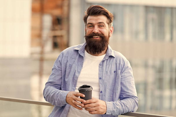 Life happens after coffee. Happy hipster drink takeaway coffee. Bearded man enjoy drinking coffee outdoor. Take away coffee habit. Hot morning drink. Breakfast - Φωτογραφία, εικόνα