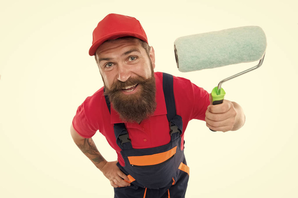 Skillful and professional painter. Bearded man painter isolated on white. Wall painter with painting tool. Brush roller painter. Painters work. Construction and renovation. Decoration and decor - Foto, immagini