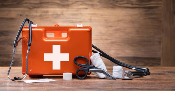 First Aid Kit With Medical Equipment On Wooden Background - Photo, Image