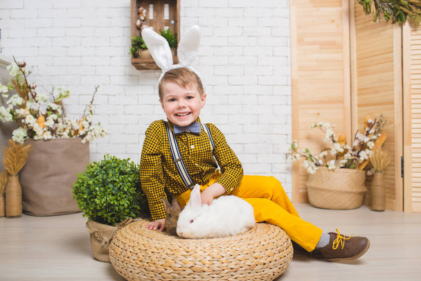 Boy with a rabbit - Фото, изображение