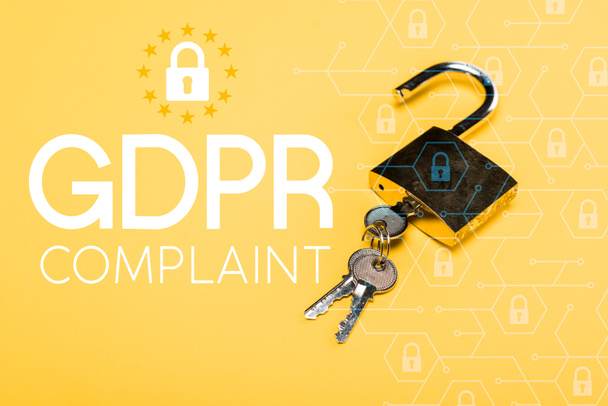 padlock with keys near gdpr complaint lettering on yellow  - Photo, Image