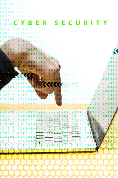 cropped view of hacker pointing with finger at laptop near cyber security lettering on white  - Foto, immagini