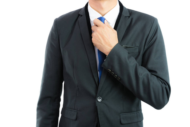 Businessman adjusting necktie isolated on over white background - Fotografie, Obrázek