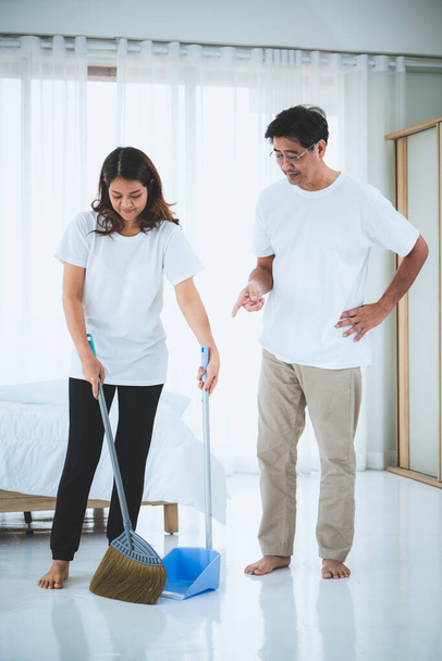 Asian senior couple cleaning bedroom floor. Retirement and healthy elderly concept. - Foto, Bild