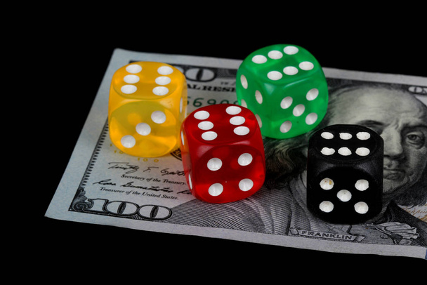 colored DICE on the dollar on black background - Photo, Image