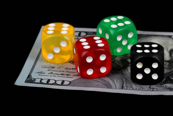 colored DICE on the dollar on black background - Photo, Image