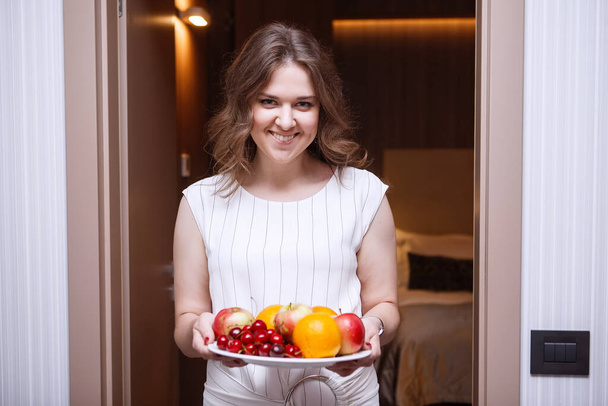 Happy female with fruit. - Zdjęcie, obraz