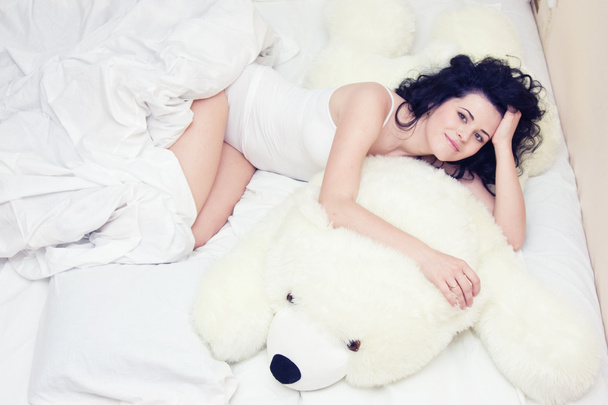 Young girl with teddy bear - Fotografie, Obrázek