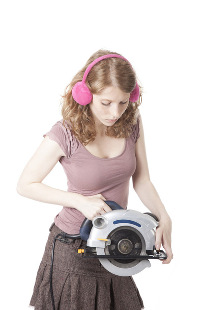 young pretty woman with circular saw - Foto, Imagem