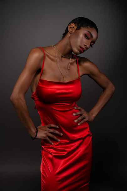 Slim black woman in red - Фото, изображение