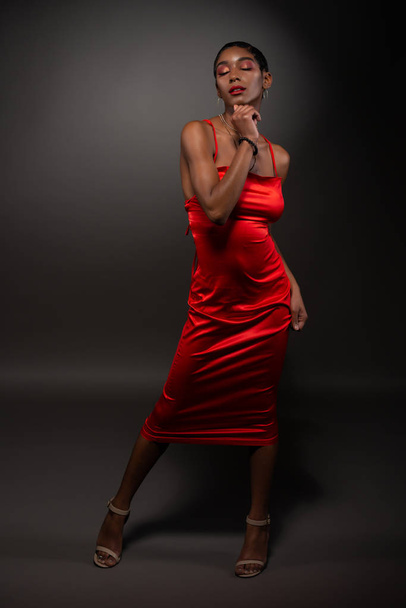 Slim black woman in red - Fotó, kép