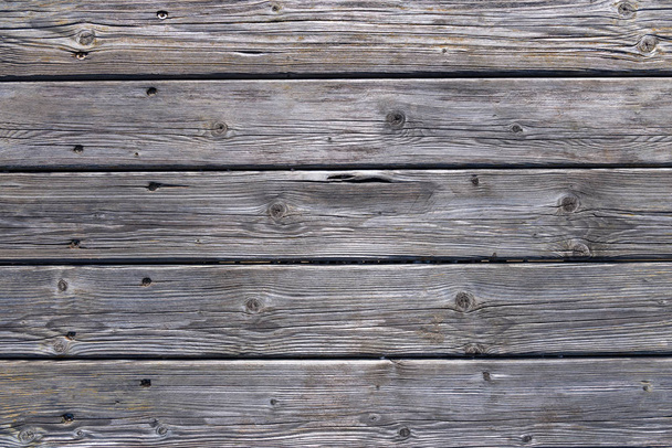 Dark wooden background texture. Old fence panels with natural patterns. - Photo, image