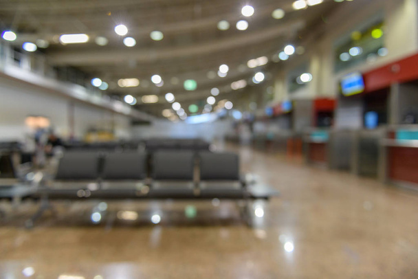 Passenger seats in Departure lounge in airport terminal blured, travel concept. - Fotoğraf, Görsel