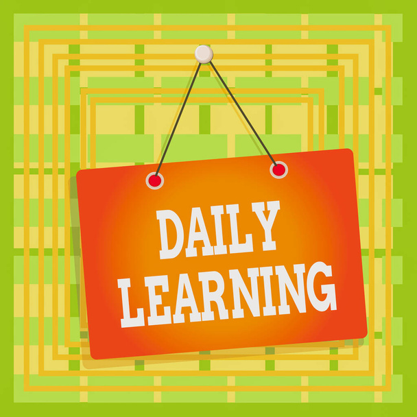 Text sign showing Daily Learning. Business photo text The everyday acquisition of knowledge or skills acquired Colored memo reminder empty board blank space attach background rectangle - Photo, Image