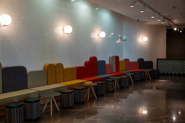 Hall with colorful seats and illuminated lamps - Photo, Image