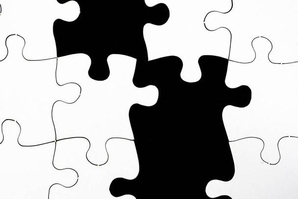 An illustration of black and white pieces of a jigsaw puzzle - Foto, Bild