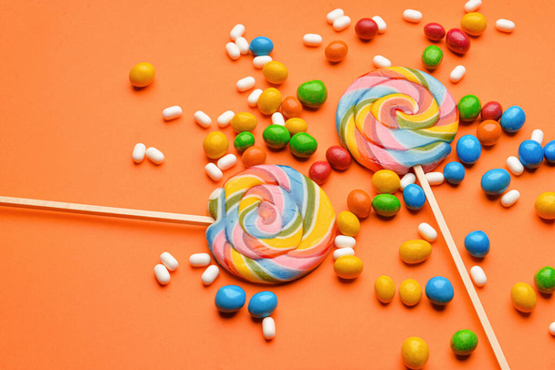 Assortment of tasty candies on color background - Fotó, kép